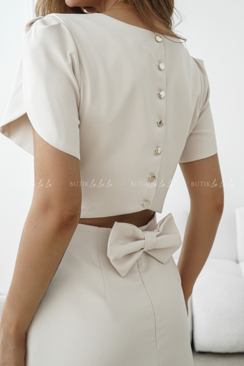 Sukienka mini z guzikami i ozdobną kokardką jasno beżowa Mellone